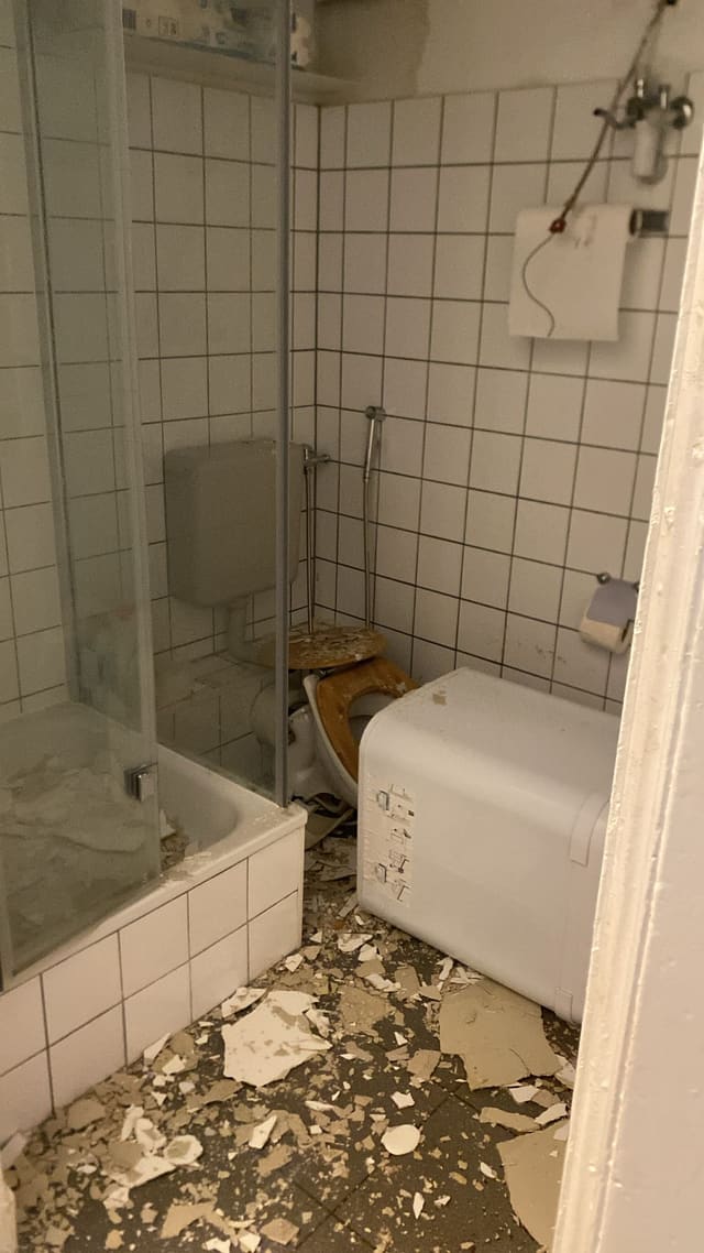 Bathroom stripped back to brick and debris during a renovation