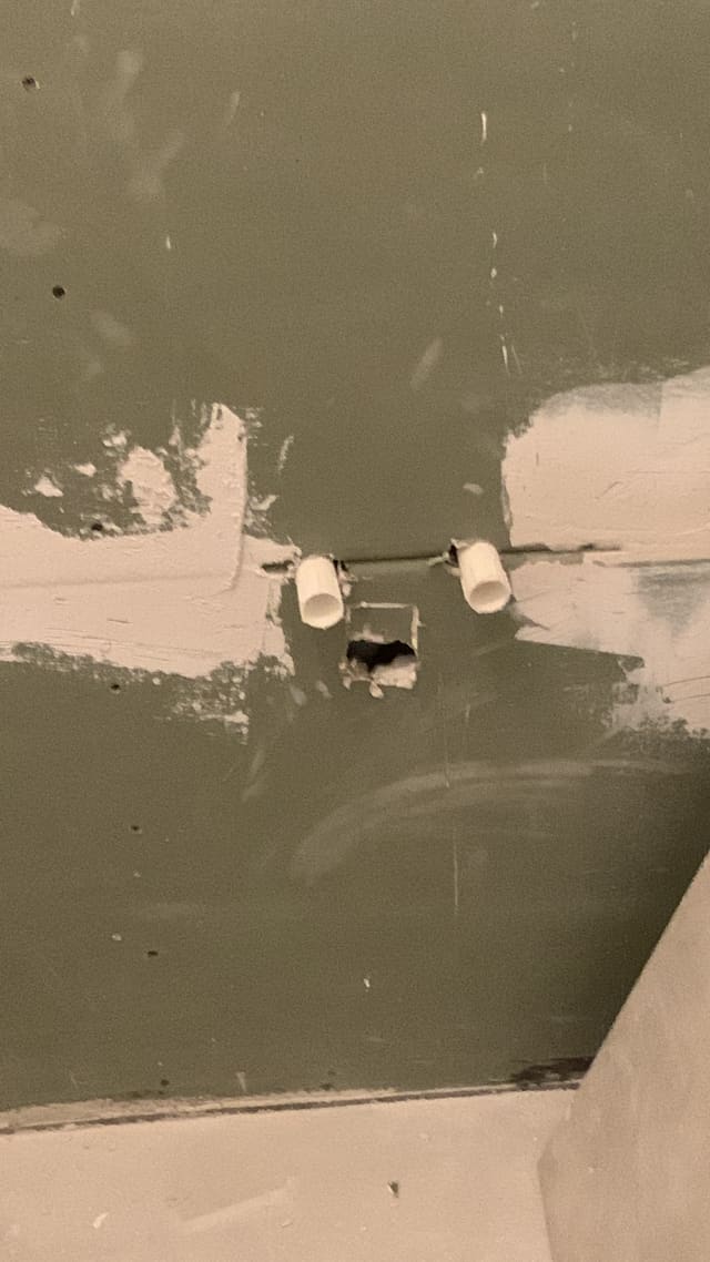 First-fix electrical box set into cement board ahead of bathroom tiling
