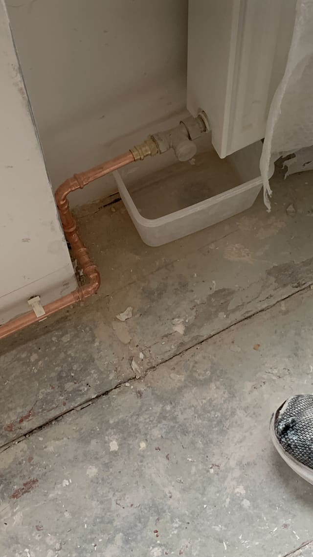 Exposed copper pipework with the toilet cistern removed during a bathroom first fix
