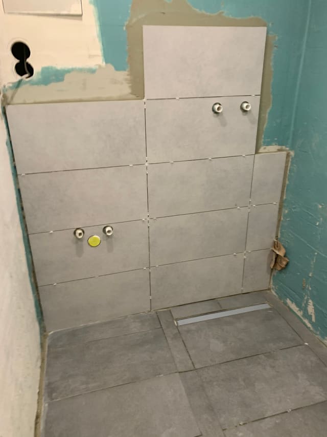 Tiled shower niche corner with two shower valves fitted