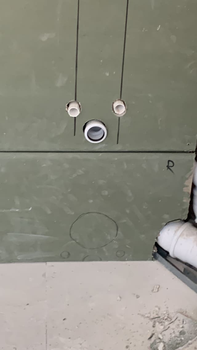 First-fix wiring with bare cable ends and ceiling rose ahead of plastering