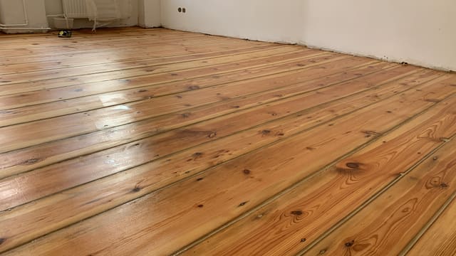 Wide room with new wood plank flooring