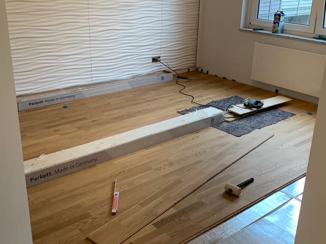 Laying new flooring against a textured feature wall