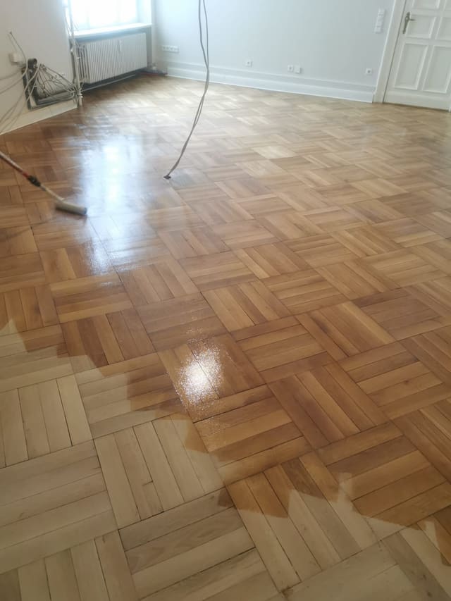 Freshly cleaned herringbone parquet floor